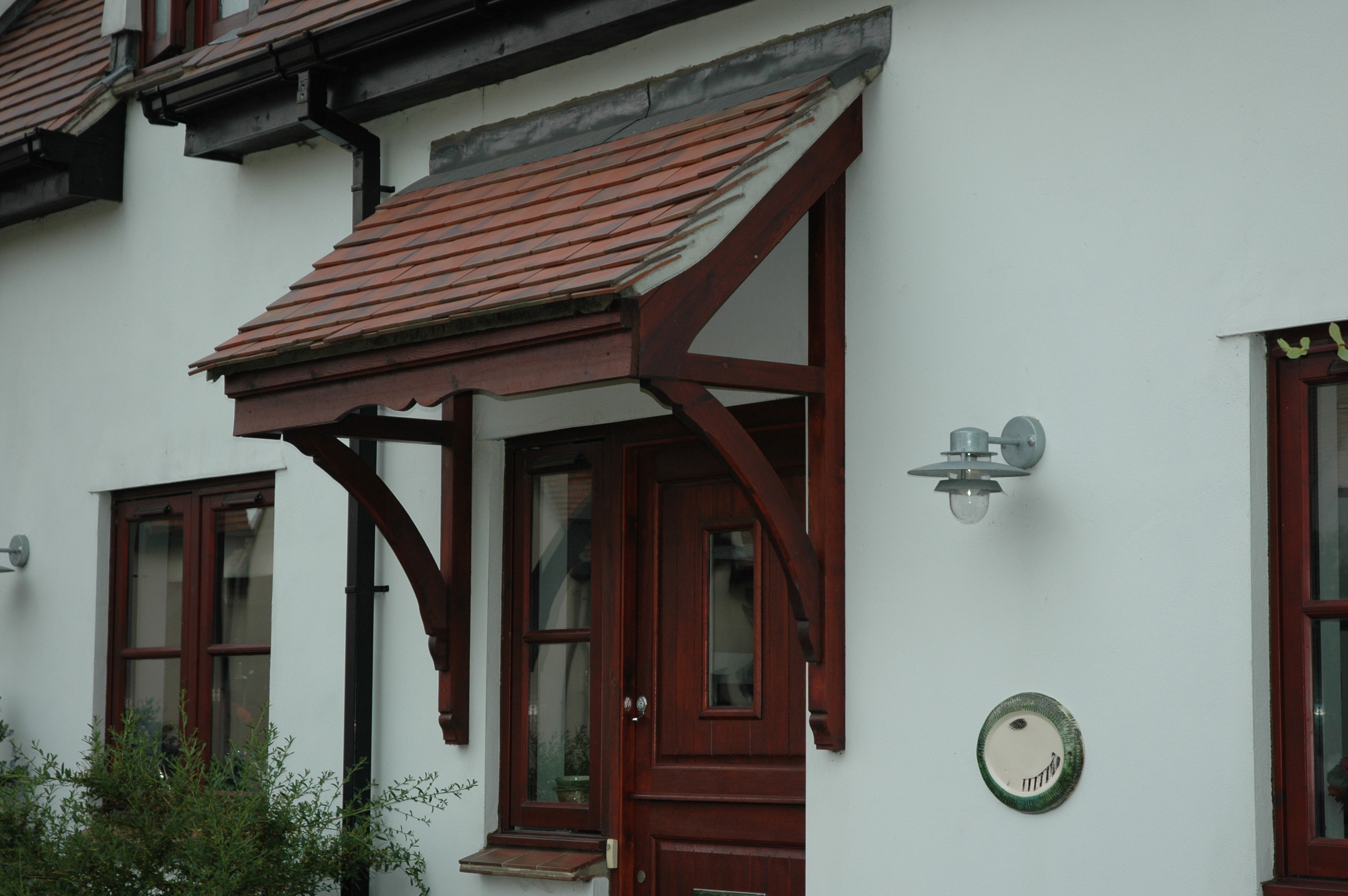 Dark stained Door canopy